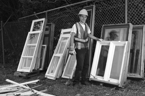 Construction site with builders removing waste in Kensington