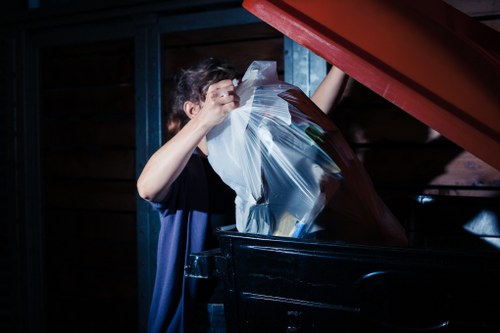 Experienced movers loading furniture into a van in Kensington