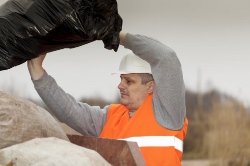 Workers handling hazardous waste safely